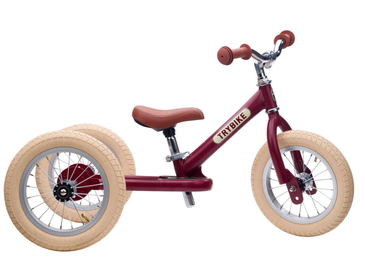 Trybike rouge vintage en version tricycle 3 roues, vue de profil